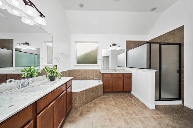 4663 Rockton Hills Ln, Sugar Land, TX 77479 - bathroom featuring vaulted ceiling, a stall shower, a garden tub, tile patterned flooring, and two vanities