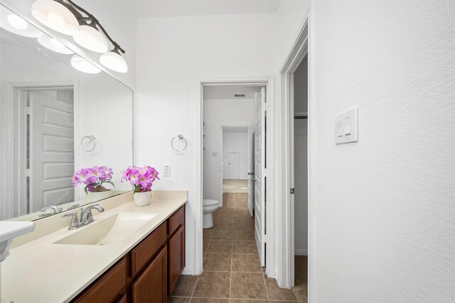 4663 Rockton Hills Ln, Sugar Land, TX 77479 - bathroom with tile patterned flooring, toilet, and vanity