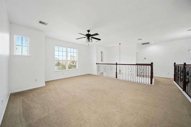 4663 Rockton Hills Ln, Sugar Land, TX 77479 - unfurnished room featuring a ceiling fan, light colored carpet, and baseboards