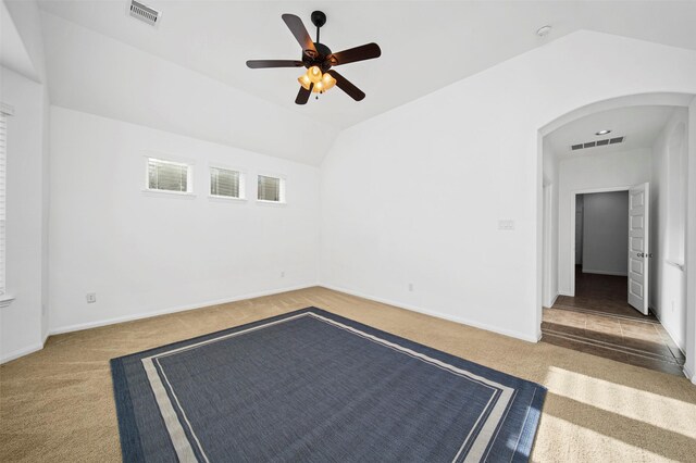 4663 Rockton Hills Ln, Sugar Land, TX 77479 - carpeted spare room featuring arched walkways, a ceiling fan, vaulted ceiling, and baseboards