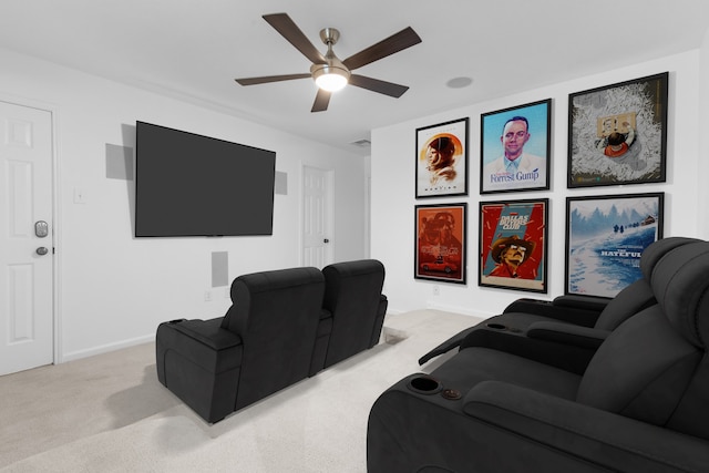 cinema featuring light carpet, ceiling fan, and baseboards