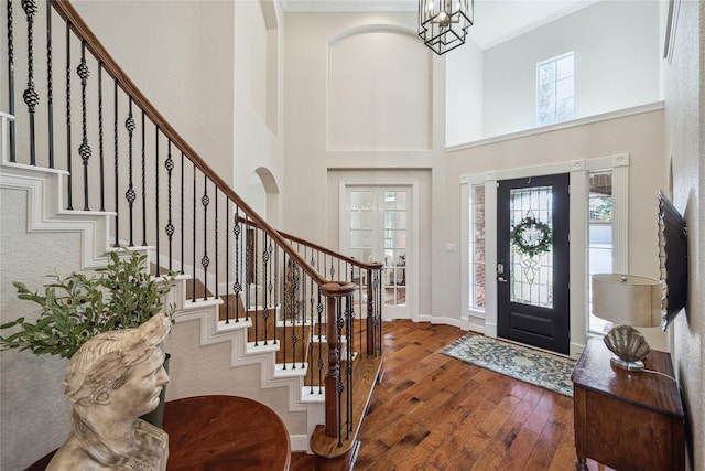 6338 Collina Springs Ct, Houston, TX 77041 - entrance foyer featuring hardwood / wood-style flooring, crown molding, stairway, a high ceiling, and baseboards