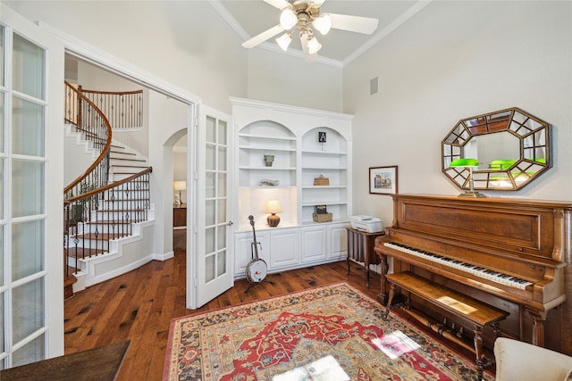 6338 Collina Springs Ct, Houston, TX 77041 - living area featuring a towering ceiling, ornamental molding, stairway, french doors, and arched walkways