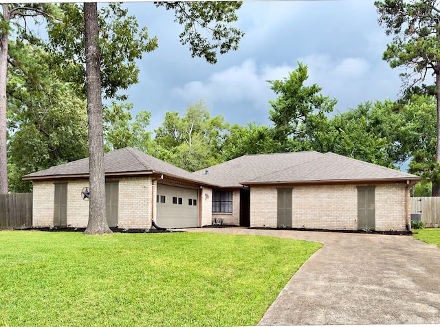 16007 Sailfin St, Crosby, TX 77532 - view of front of house with a garage, brick siding, concrete driveway, and a shingled roof