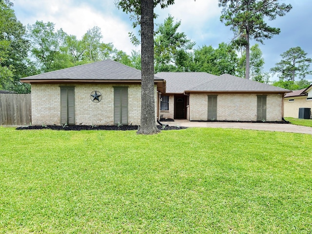16007 Sailfin St, Crosby, TX 77532 - view of front of house featuring brick siding, roof with shingles, and central AC
