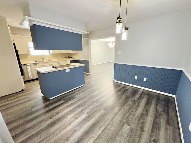 16007 Sailfin St, Crosby, TX 77532 - kitchen with a sink, stainless steel dishwasher, a wainscoted wall, black electric cooktop, and dark wood finished floors