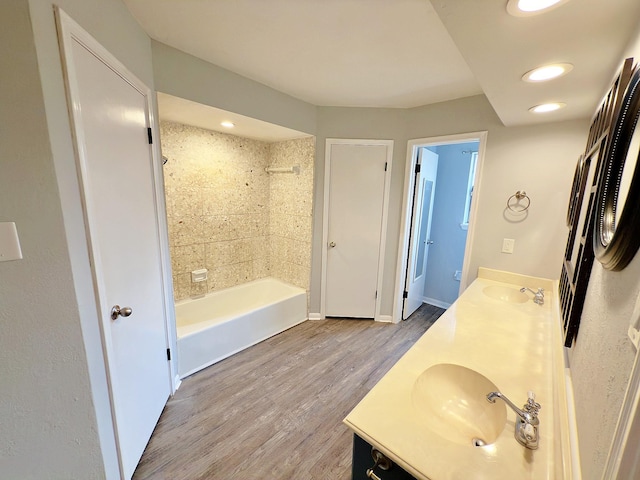 16007 Sailfin St, Crosby, TX 77532 - full bathroom featuring double vanity, wood finished floors, shower / bathtub combination, recessed lighting, and baseboards