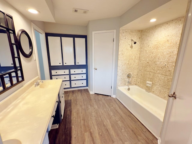 16007 Sailfin St, Crosby, TX 77532 - bathroom with vanity, wood finished floors,  shower combination, baseboards, and recessed lighting