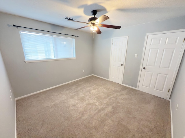 16007 Sailfin St, Crosby, TX 77532 - unfurnished bedroom featuring carpet, baseboards, and ceiling fan