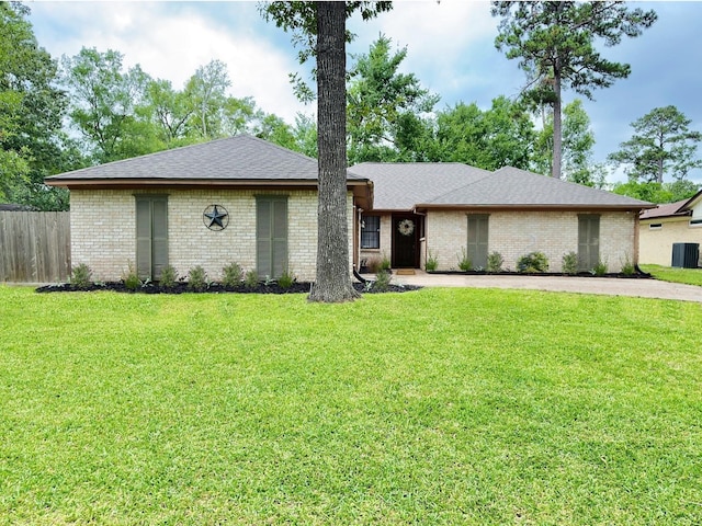 16007 Sailfin St, Crosby, TX 77532 - view of front of property featuring brick siding, driveway, and roof with shingles