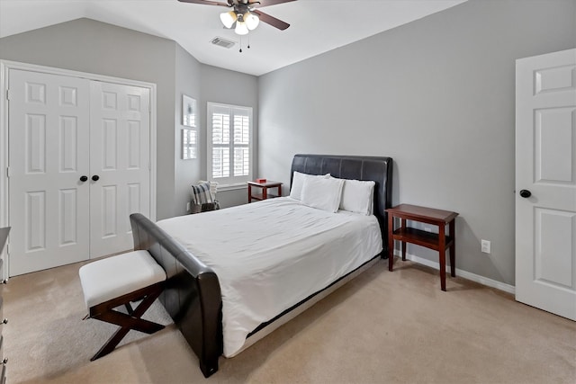 31 Brywood Pl, The Woodlands, TX 77382 - bedroom featuring light carpet, a closet, vaulted ceiling, ceiling fan, and baseboards