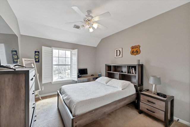31 Brywood Pl, The Woodlands, TX 77382 - bedroom featuring light colored carpet, baseboards, lofted ceiling, and ceiling fan