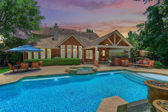 31 Brywood Pl, The Woodlands, TX 77382 - view of pool with an outdoor hangout area, a patio area, and a pool with connected hot tub