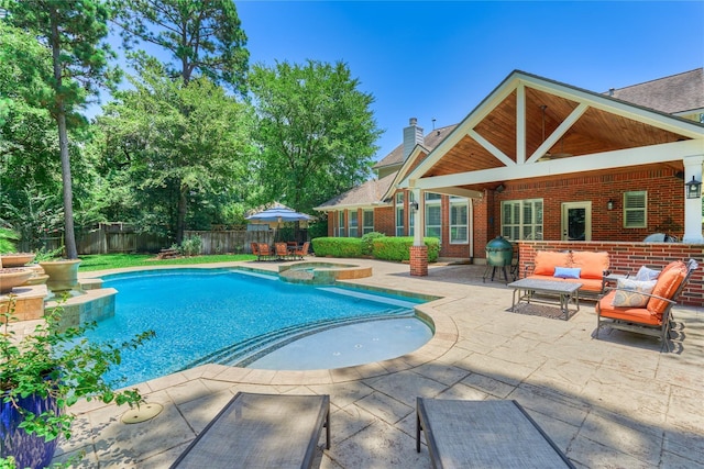 31 Brywood Pl, The Woodlands, TX 77382 - view of pool with a patio area, a fenced backyard, and a pool with connected hot tub