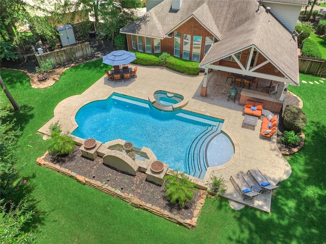 31 Brywood Pl, The Woodlands, TX 77382 - view of pool with a pool with connected hot tub, a patio area, and outdoor dining area