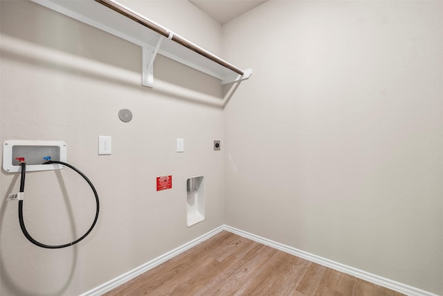 513 Bonnerville Ln, Magnolia, TX 77354 - laundry area with washer hookup, light wood finished floors, baseboards, and hookup for an electric dryer