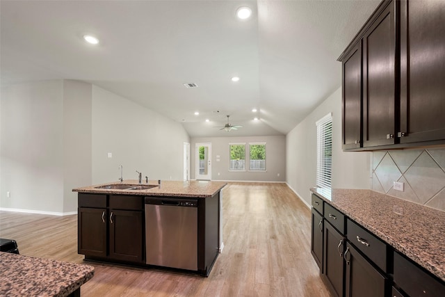 513 Bonnerville Ln, Magnolia, TX 77354 - kitchen featuring stainless steel dishwasher, a sink, light wood-style floors, stone countertops, and ceiling fan