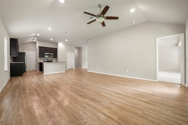 513 Bonnerville Ln, Magnolia, TX 77354 - unfurnished living room featuring lofted ceiling, ceiling fan, recessed lighting, light wood finished floors, and baseboards