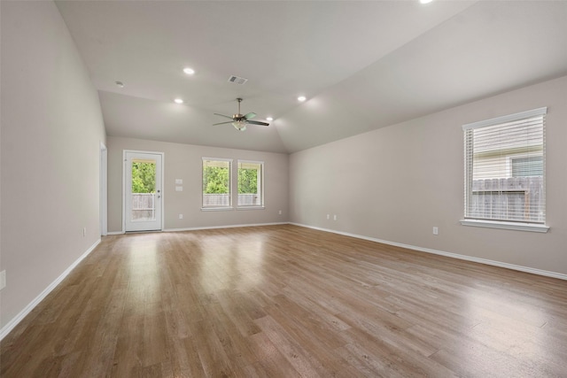513 Bonnerville Ln, Magnolia, TX 77354 - empty room with ceiling fan, wood finished floors, baseboards, vaulted ceiling, and recessed lighting