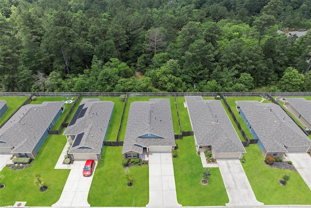 513 Bonnerville Ln, Magnolia, TX 77354 - aerial perspective of suburban area featuring a heavily wooded area