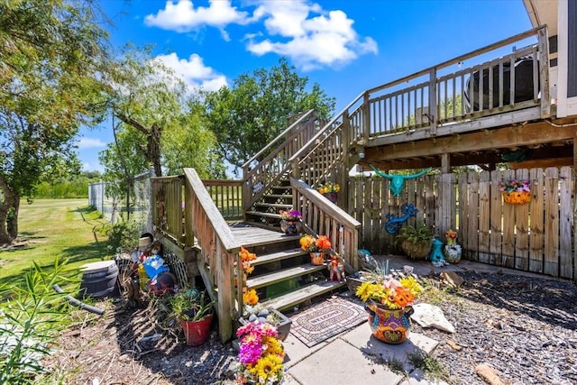 wooden deck featuring stairs and fence