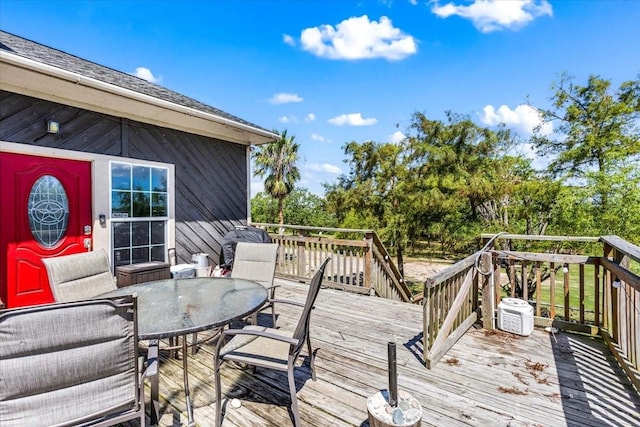 deck featuring outdoor dining area