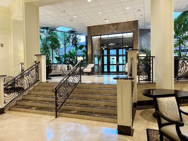 3525 Sage Rd Unit 704, Houston, TX 77056 - lobby featuring recessed lighting, stairway, and a paneled ceiling