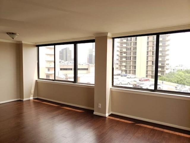 3525 Sage Rd Unit 704, Houston, TX 77056 - empty room featuring dark wood-style floors, ornamental molding, baseboards, and a city view