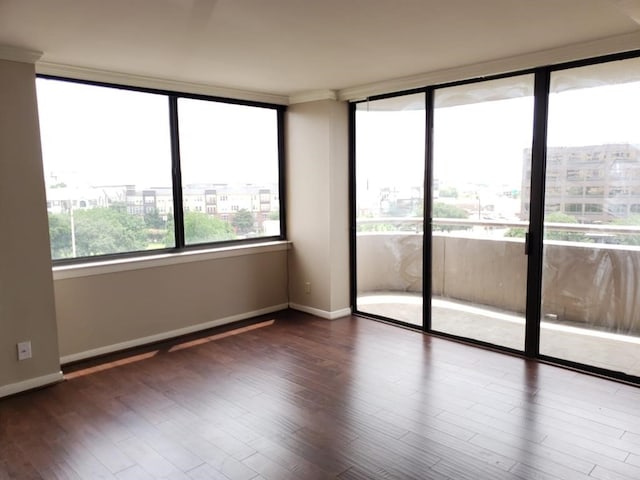 3525 Sage Rd Unit 704, Houston, TX 77056 - empty room with wood finished floors, baseboards, and crown molding