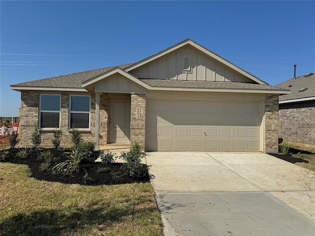 3012 Wild Dunes Dr, Katy, TX 77493 - single story home with board and batten siding, an attached garage, driveway, and a shingled roof