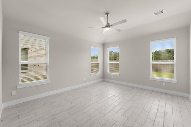 18423 Windy Knoll Way, Houston, TX 77084 - spare room featuring baseboards, ceiling fan, healthy amount of natural light, and lofted ceiling