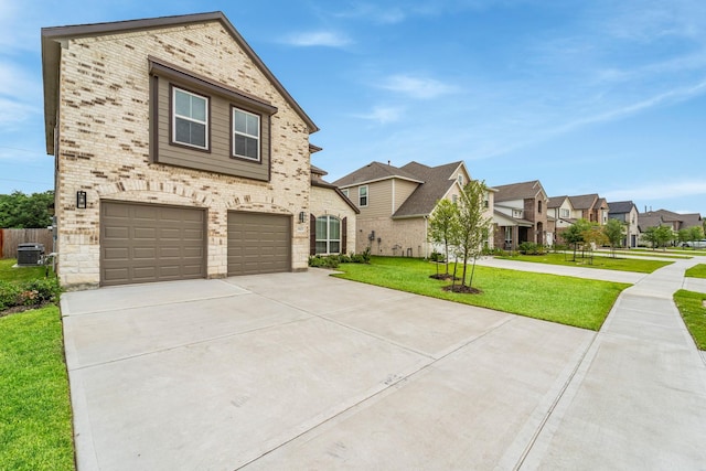 18423 Windy Knoll Way, Houston, TX 77084 - view of front of property with a garage, central air condition unit, concrete driveway, a front yard, and brick siding