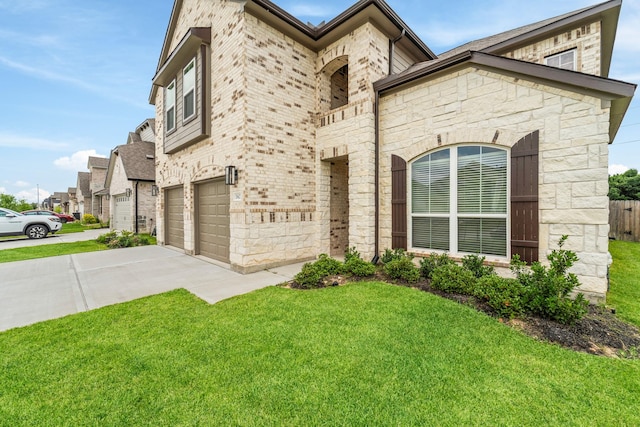 18423 Windy Knoll Way, Houston, TX 77084 - view of front of property featuring stone siding, a front yard, concrete driveway, and an attached garage
