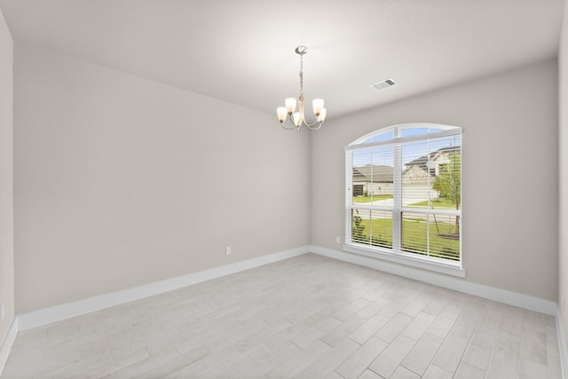 18423 Windy Knoll Way, Houston, TX 77084 - empty room with a chandelier, light wood-style flooring, and baseboards