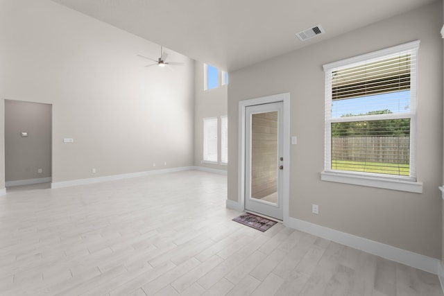 18423 Windy Knoll Way, Houston, TX 77084 - spare room featuring ceiling fan, light wood-style flooring, baseboards, and a high ceiling