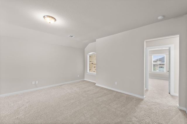 18423 Windy Knoll Way, Houston, TX 77084 - unfurnished room featuring light colored carpet, a smoke detector, baseboards, and vaulted ceiling