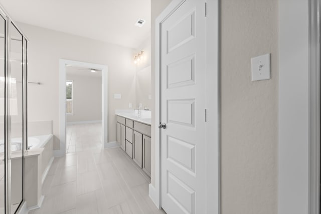 18423 Windy Knoll Way, Houston, TX 77084 - bathroom featuring a garden tub, vanity, and a stall shower