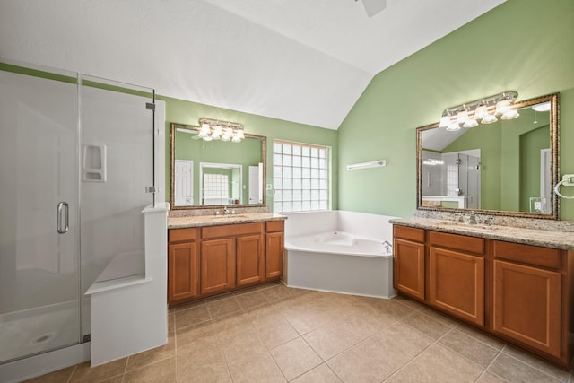 1910 Edenfield Ln, Sugar Land, TX 77479 - full bath featuring lofted ceiling, a shower stall, a garden tub, two vanities, and tile patterned flooring