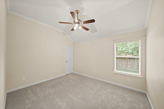 1910 Edenfield Ln, Sugar Land, TX 77479 - spare room featuring crown molding, lofted ceiling, light colored carpet, ceiling fan, and baseboards