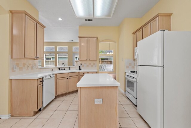 13014 Vivienne Westmoreland Dr, Cypress, TX 77429 - kitchen featuring white appliances, light brown cabinets, decorative backsplash, and recessed lighting