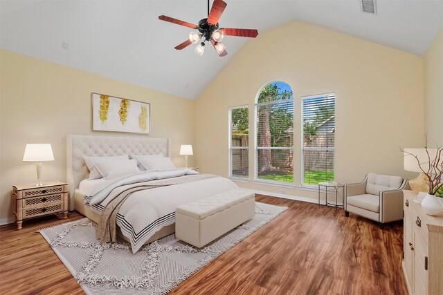13014 Vivienne Westmoreland Dr, Cypress, TX 77429 - bedroom featuring wood finished floors, high vaulted ceiling, baseboards, and a ceiling fan