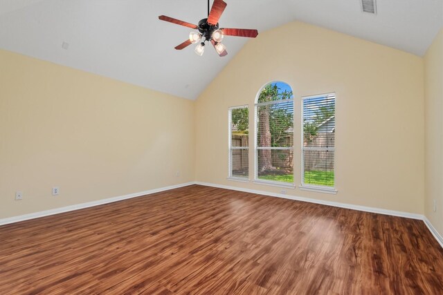 13014 Vivienne Westmoreland Dr, Cypress, TX 77429 - empty room with wood finished floors, a ceiling fan, baseboards, and high vaulted ceiling