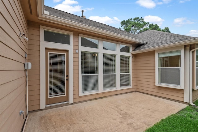 13014 Vivienne Westmoreland Dr, Cypress, TX 77429 - view of exterior entry featuring a patio and a shingled roof