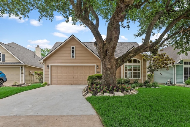 13014 Vivienne Westmoreland Dr, Cypress, TX 77429 - view of front facade featuring concrete driveway, a garage, a front yard, and roof with shingles