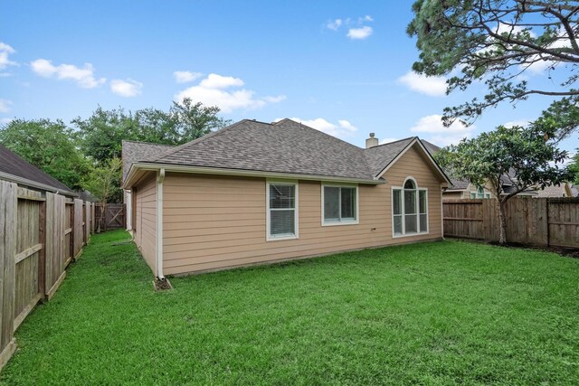 13014 Vivienne Westmoreland Dr, Cypress, TX 77429 - rear view of property with roof with shingles