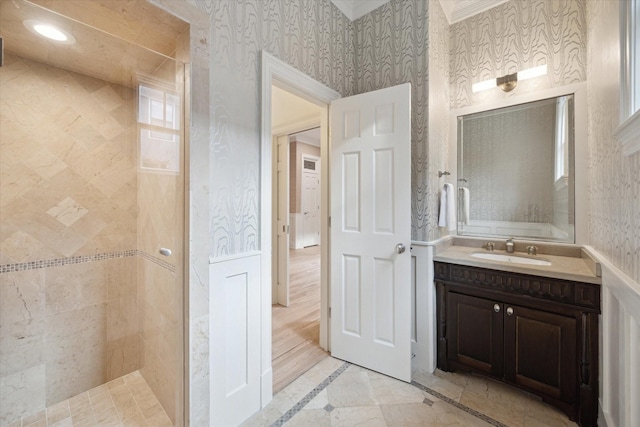 3707 Jardin St, Houston, TX 77005 - full bath featuring inlaid floor details, vanity, a tile shower, and ornamental molding