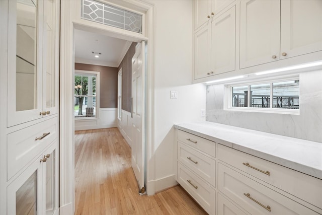 3707 Jardin St, Houston, TX 77005 - hall featuring crown molding, light wood-style floors, and wainscoting