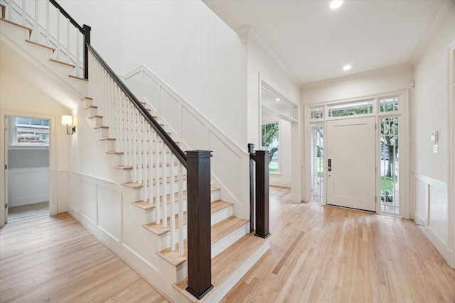 3707 Jardin St, Houston, TX 77005 - foyer entrance with a decorative wall, light wood finished floors, stairway, recessed lighting, and a wainscoted wall