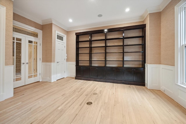 3707 Jardin St, Houston, TX 77005 - spare room with french doors, a decorative wall, crown molding, wood finished floors, and a wainscoted wall
