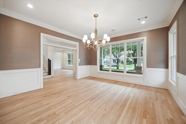 3707 Jardin St, Houston, TX 77005 - unfurnished room featuring wainscoting, stairs, a chandelier, light wood-style flooring, and crown molding
